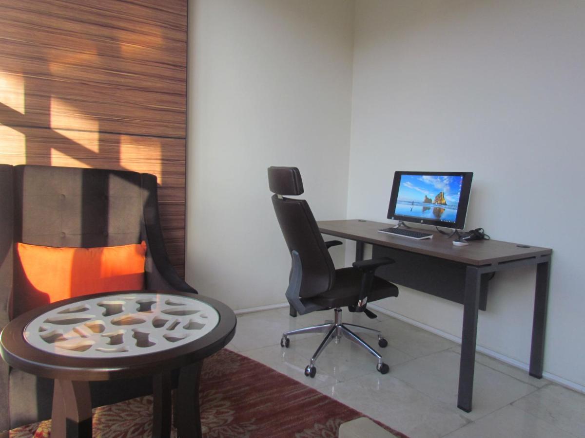 Blue Inn Boutique Abha Dış mekan fotoğraf A typical office chair